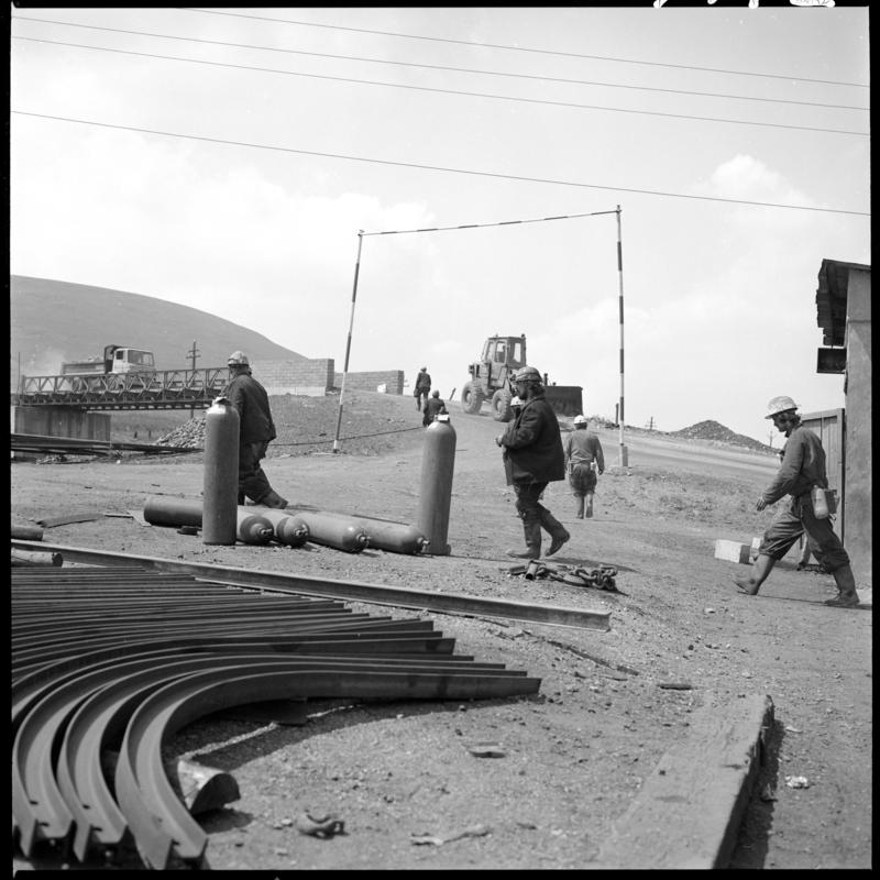 Black and white film negative showing men working at the Blaenavon drift yard.