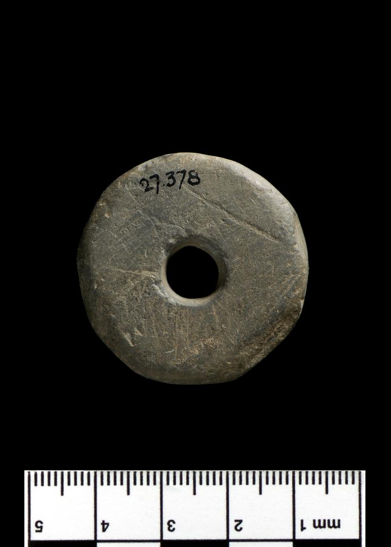 Medieval stone spindle whorl