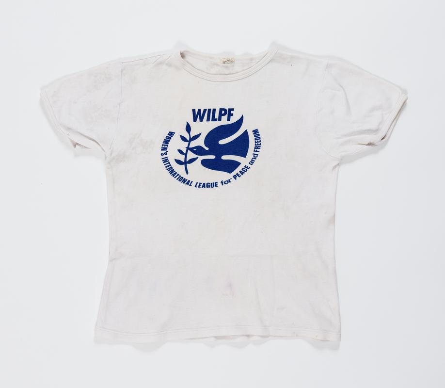 White t-shirt with blue logo for 'WILPF 'Women's International League for Peace and Freedom'. Worn by Thalia Campbell in 1995 on the 'Sew to Say' march from Helsinki to Beijing.