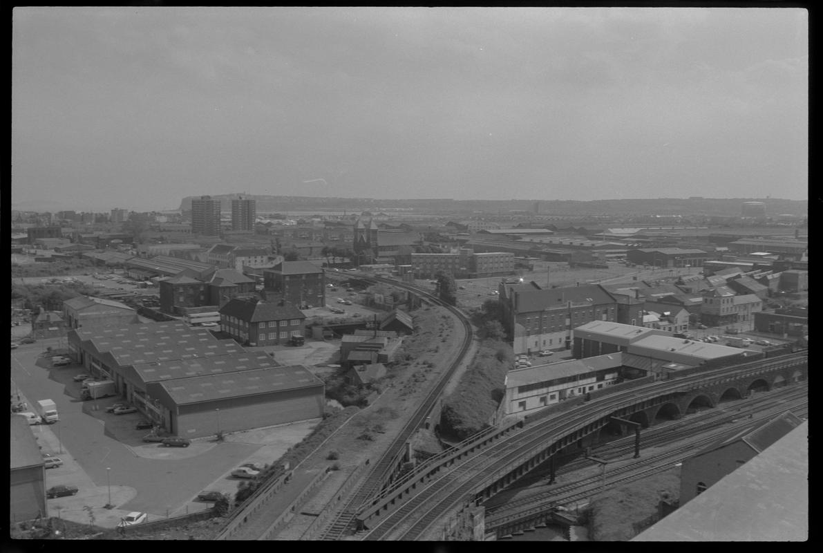 View of Butetown from Bute Terrace, with railway junction from Queen Street and main line in foreground, and flats with Penarth Head in background.