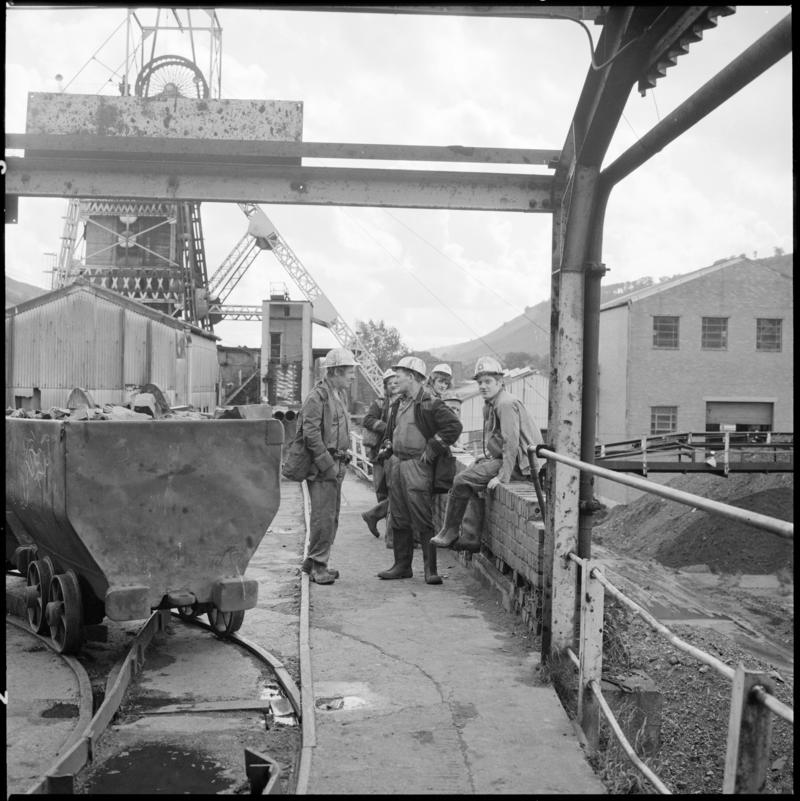 Black and white film negative showing miners on the surface, Merthyr Vale Colliery, 21 September 1981.  'Merthyr Vale 21 Sep 1981' is transcribed from original negative bag.