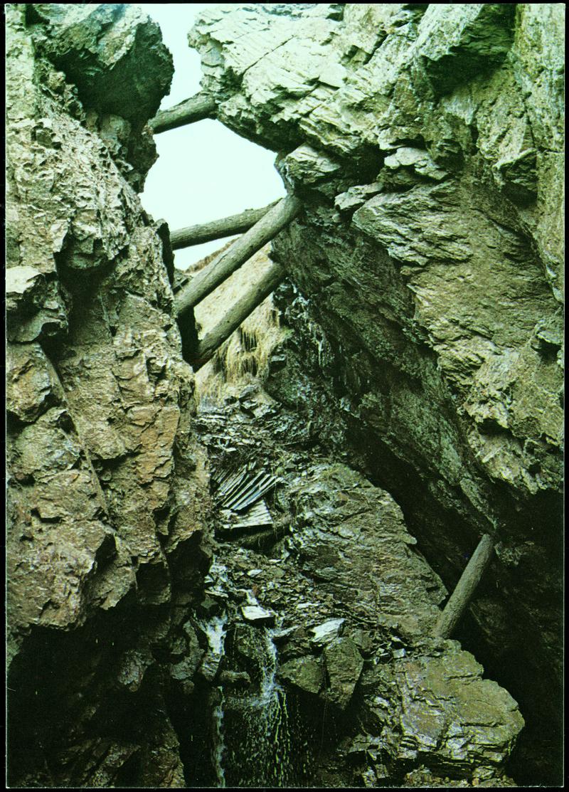 Old Lead and Zinc workings at Frongoch Mine near Devil's Bridge, showing the 'stullis', or timbers, on which the miners worked
