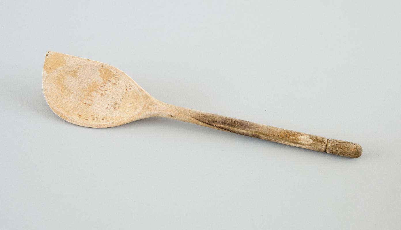 Wooden spoon, with squared corner.