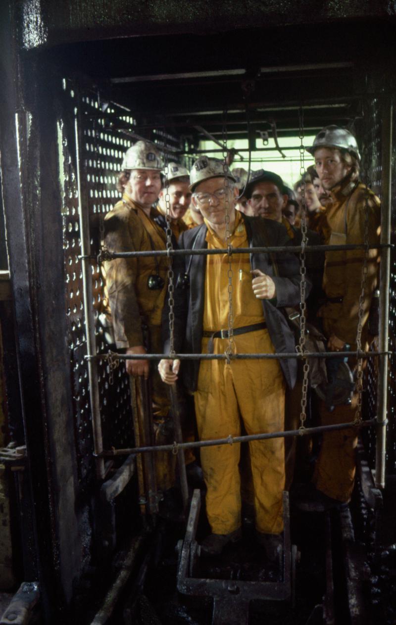 Colour film slide showing miners in cage at pit top, Oakdale Colliery 21 May 1981.