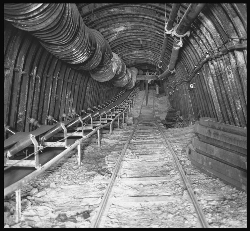 Black and white film negative showing an underground roadway with device for stopping runaway drams, Merthyr Vale Colliery 2 July 1981.