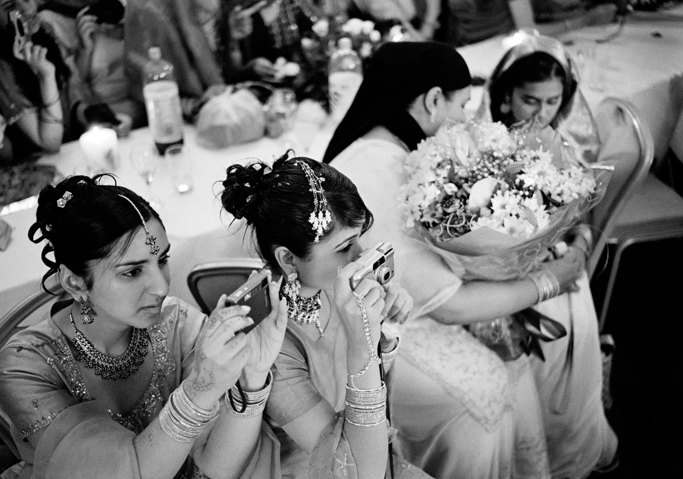 Asian wedding in the City Hall in Cardiff. The aversion of being photographed is not prevalent in young modern muslims