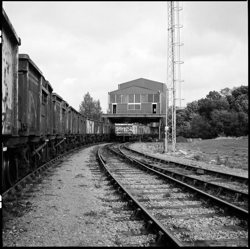 Black and white film negative showing a railtrack and carriages, Betws Mine.  'Betws Mine' is transcribed from original negative bag.