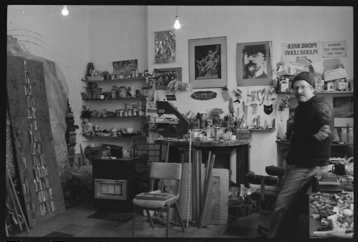 Interior of 'AADW' Workshop, with a man leaning against a table. (Association of Artists and Designers in Wales Print Workshop).