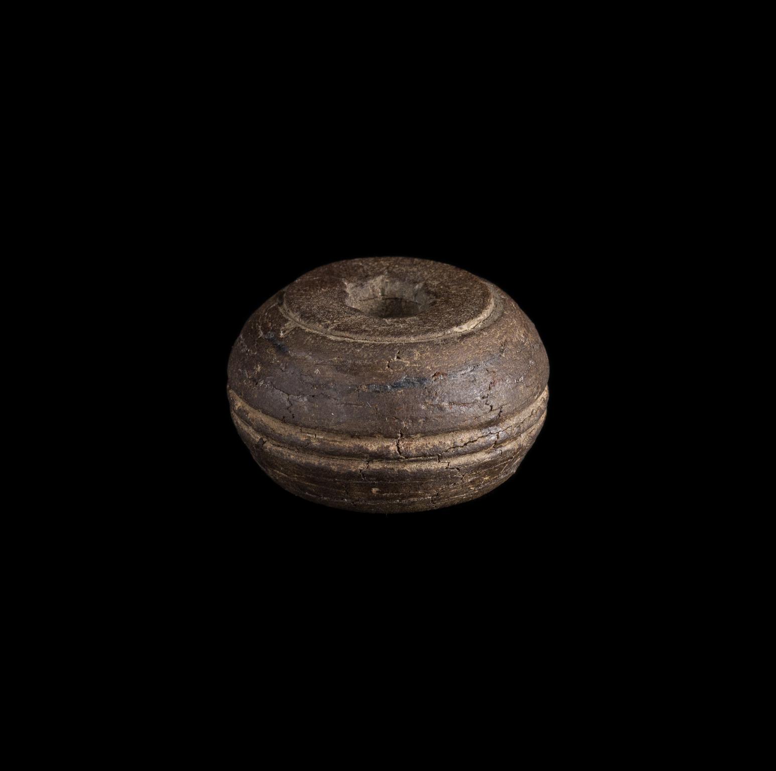 Roman shale spindle whorl