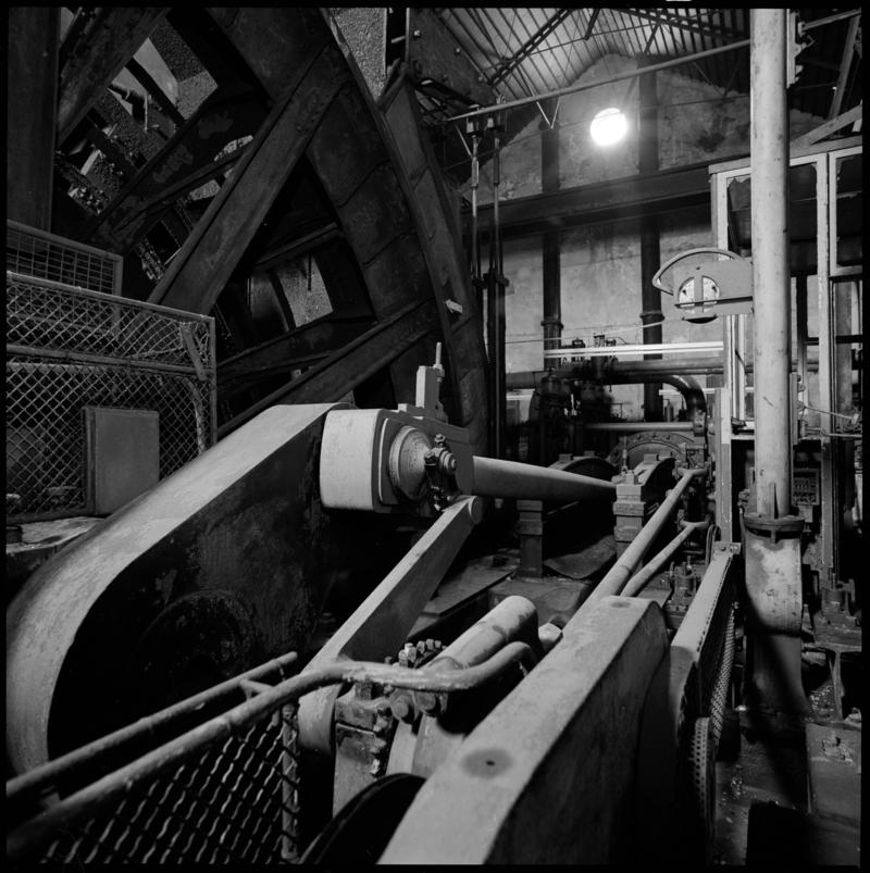 Black and white film negative showing the crank and connecting rod and wheel of the winding engine, Elliot Colliery 1974.  'East Elliot' is transcribed from original negative bag.