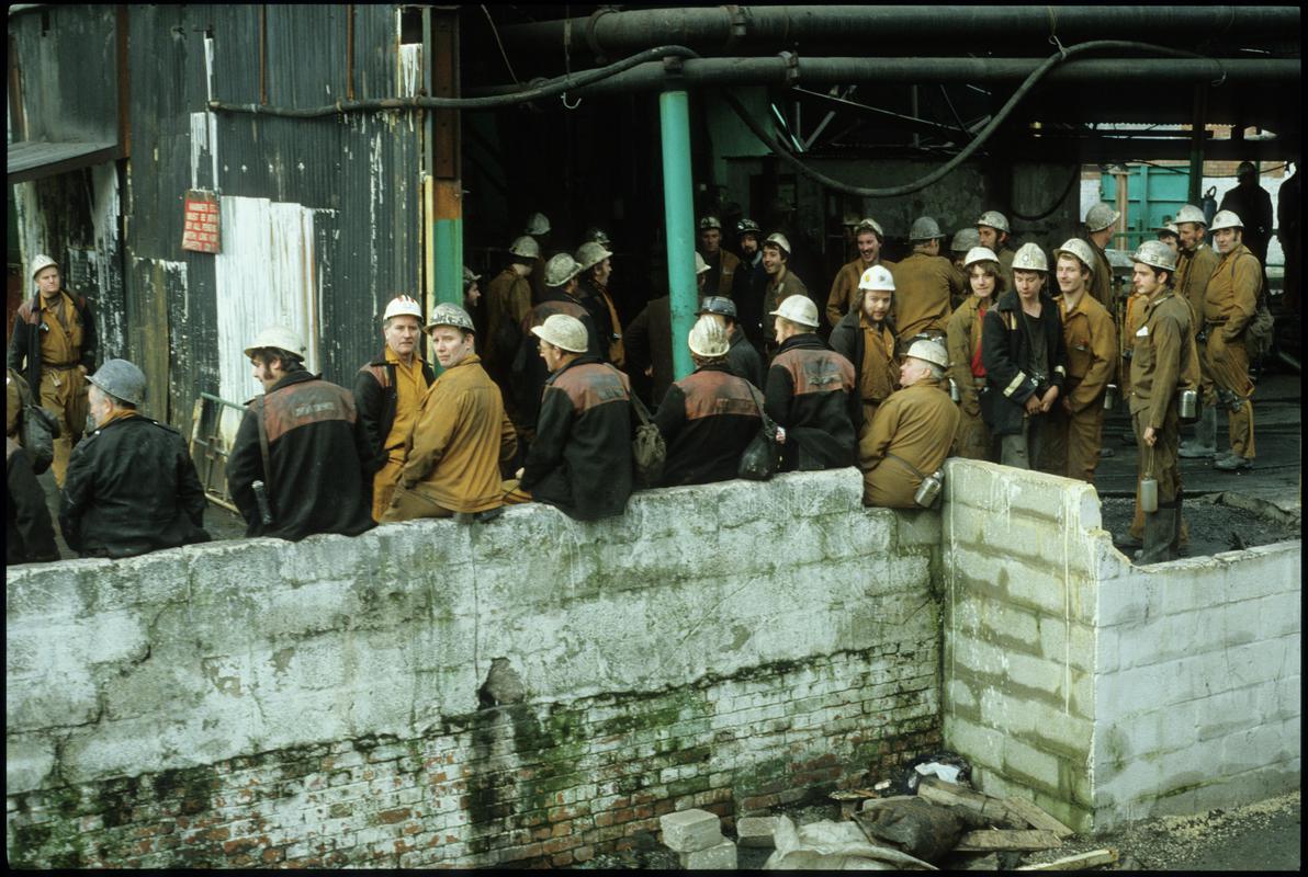 Colour film slide showing Coegnant Colliery miners at pit top, 25 November 1981.