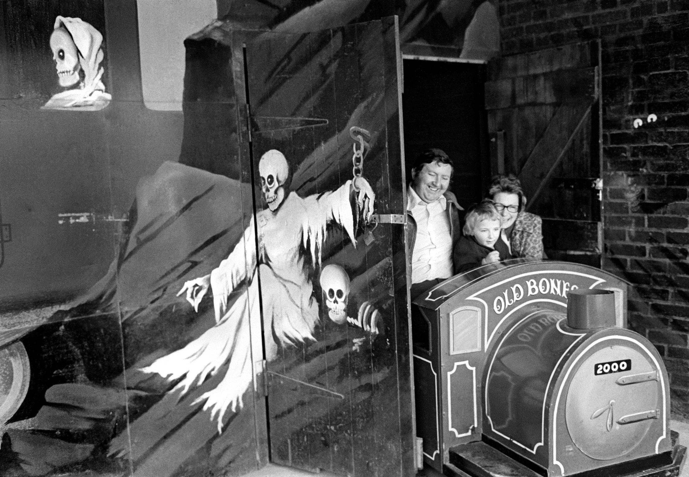 The fun fair at Porthcawl. A family have the fun/horror of the Ghost Train. Wales