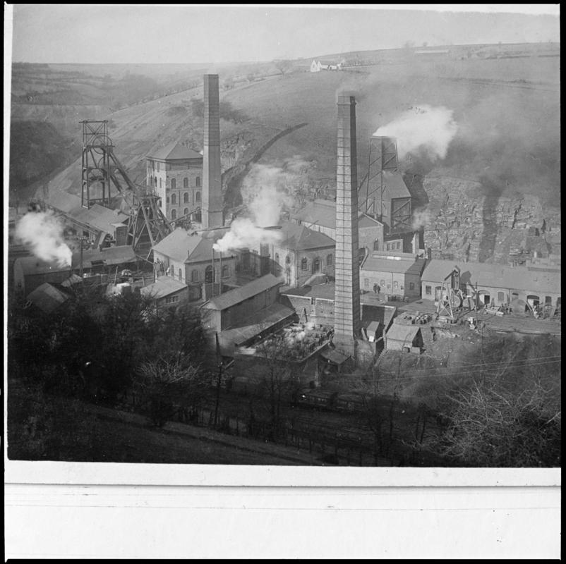Black and white film negative of a photograph showing a surface view of Tirpentwys Colliery c.1910. 'Tirpentwys Colliery' is transcribed from original negative bag.