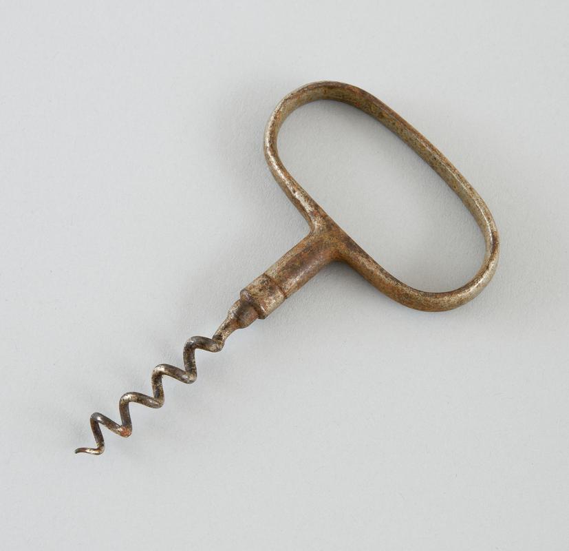 Metal corkscrew with oval shaped handle.