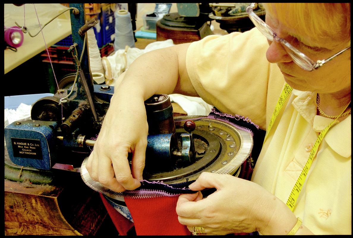 Christine Oxenham operating a toe linking machine. Corgi Hosiery Ltd factory, Ammanford, 1 July 2002.