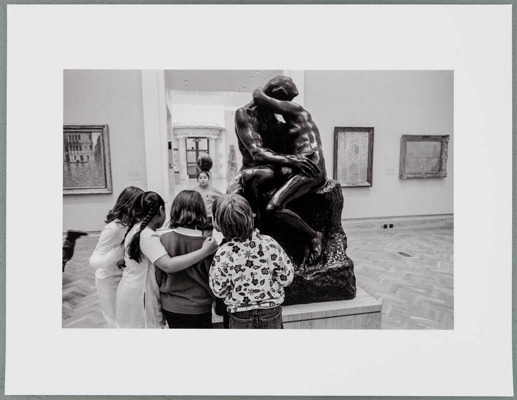 GB Wales. Cardiff. In the National Museum some students from a school party find interest in Rodin's sculpture 'The Kiss'