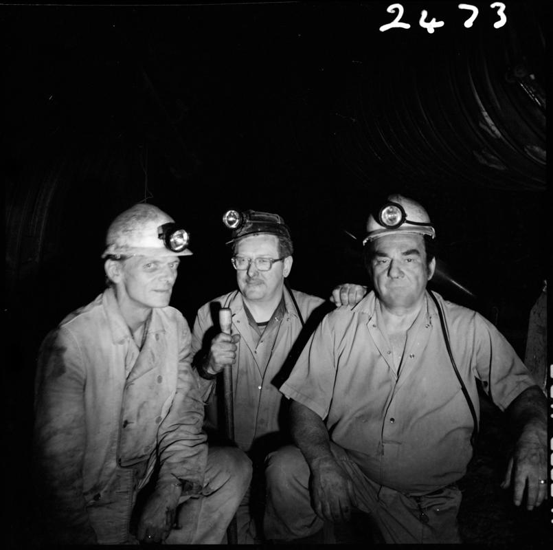 Black and white film negative showing three miners, Merthyr Vale Colliery, 2 July 1981.  'Merthyr Vale 2 Jul 1981' is transcribed from original negative bag.