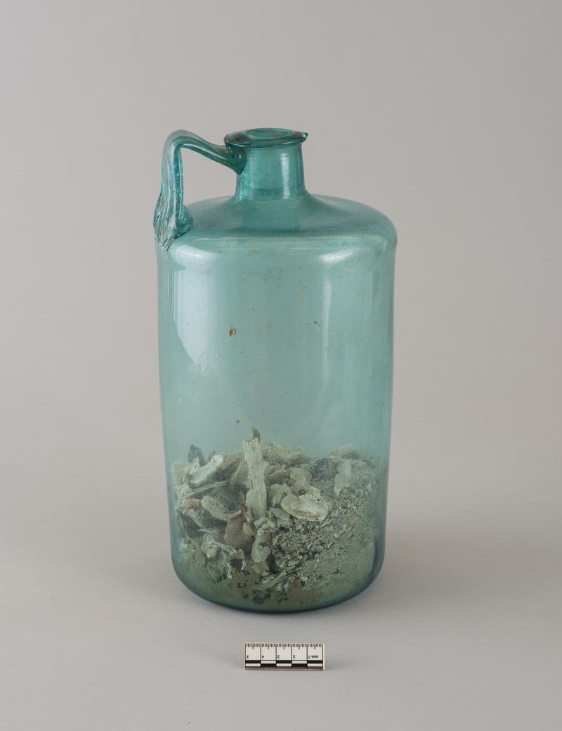 Roman glass bottle with human bones