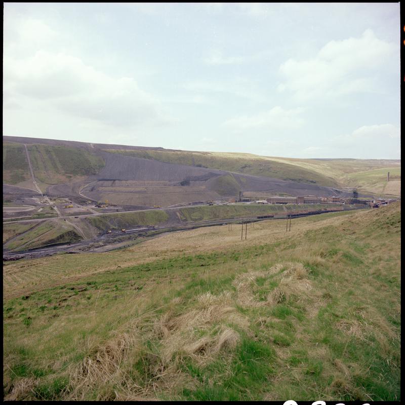 Colour film negative showing a landscape view, looking towards Maerdy Colliery.  'Mardy' is transcribed from original negative bag.