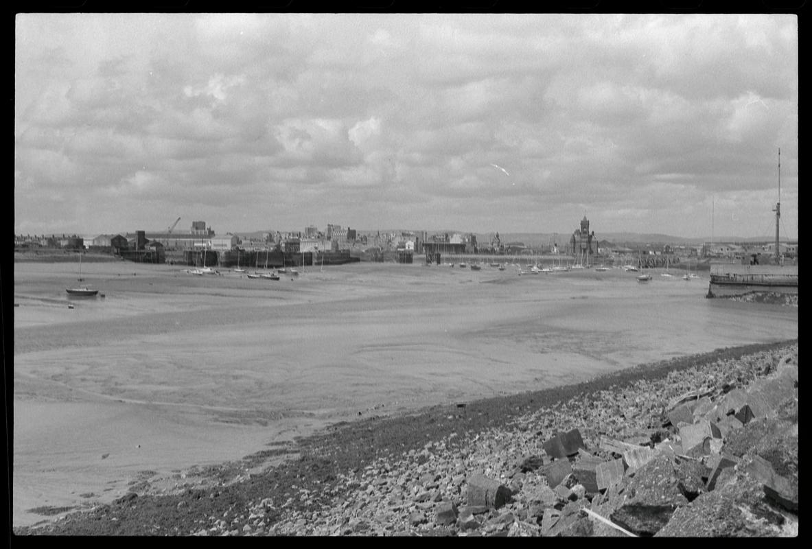 View across Cardiff Bay to the Welsh Industrial and Maritime Museum, the Pier Head Building and Dry Docks, from west side of Queen Alexandra Dock.