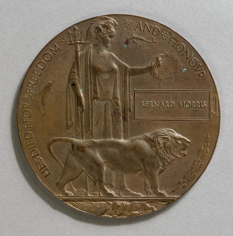 Bronze memorial plaque in envelope, often known as a 'Dead Man's Penny'. Issued to the next of kin of Petty Officer Bernard Morris.
