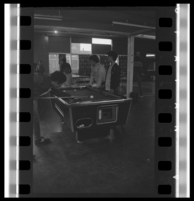 Teenagers playing pool at Butetown Youth Club.