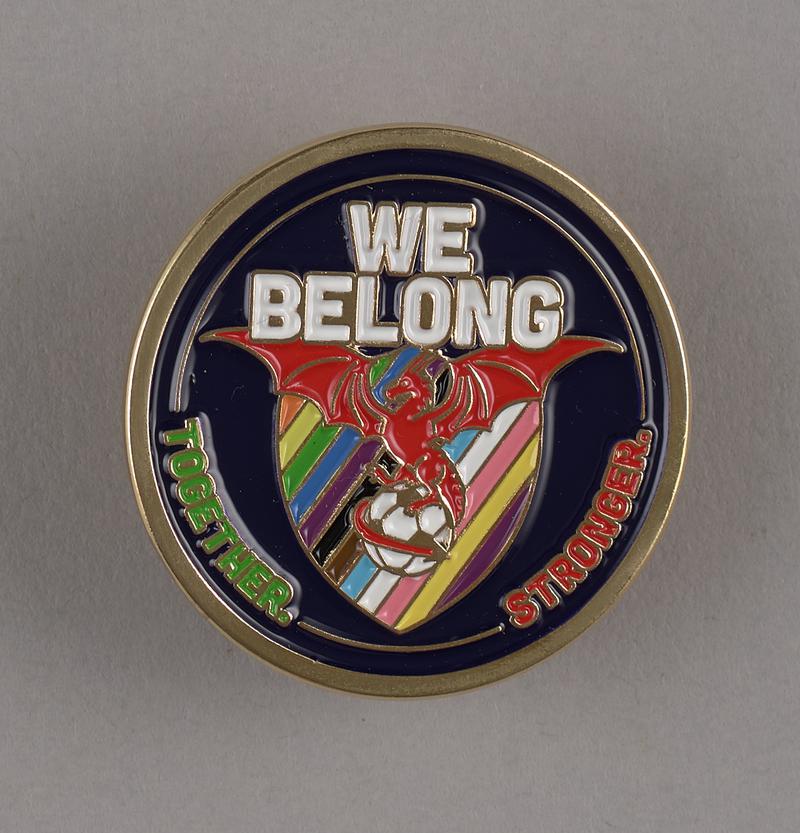 Badge 'We Belong'.
