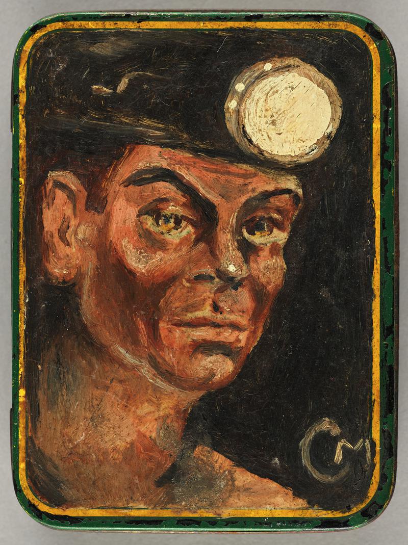 Commercial tobacco tin with head and shoulders portrait of a coal miner in oils.