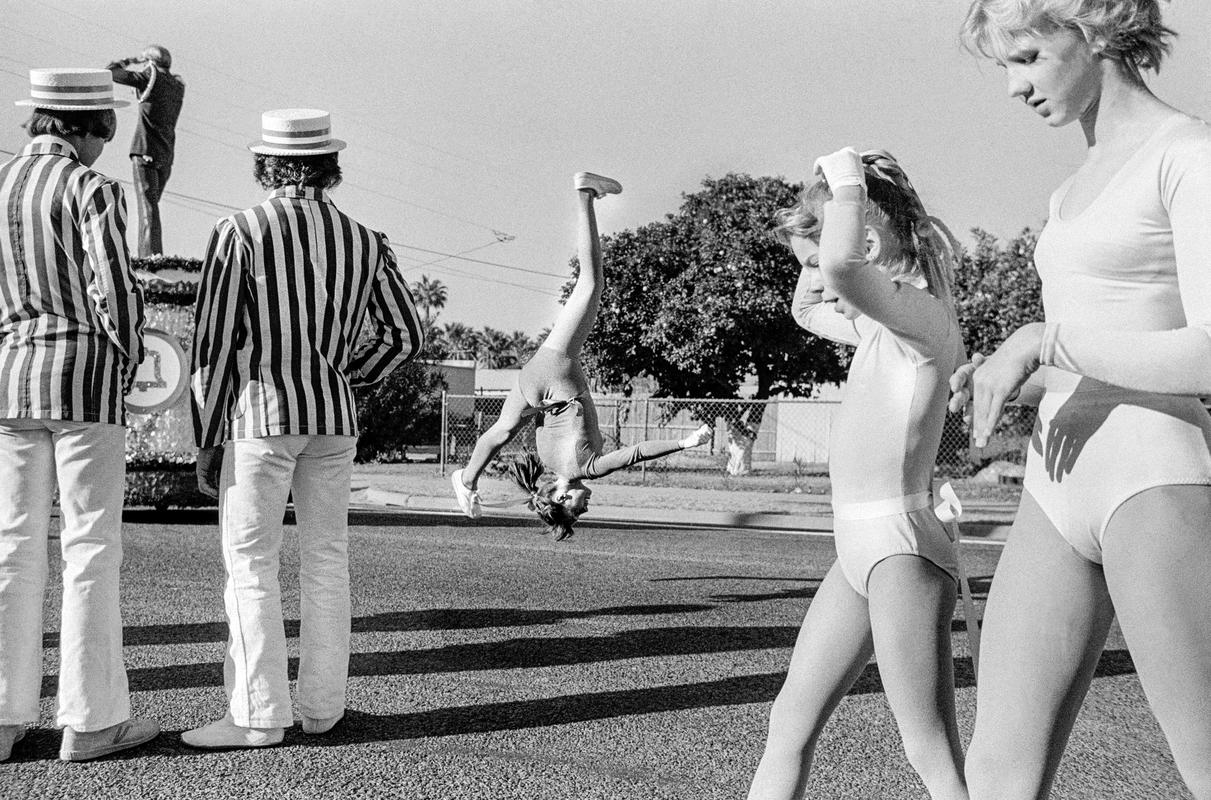 USA. ARIZONA. Phoenix. Preparation for the annual Christmas parade in Phoenix, Arizona. The marching bands are always led by Baton Twirlers who practice their acrobatics before the actual march takes place. 1979.
