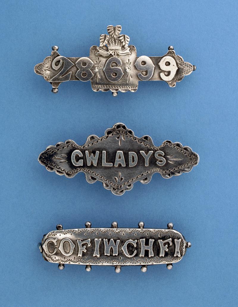 Three silver sentimental brooches (19th century)