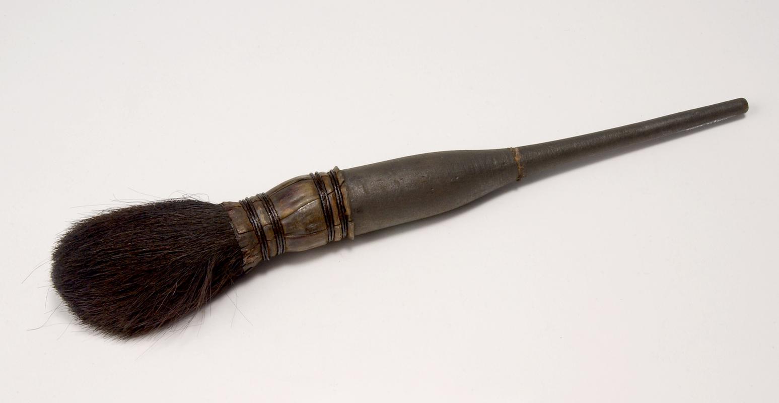 brush with wooden handle