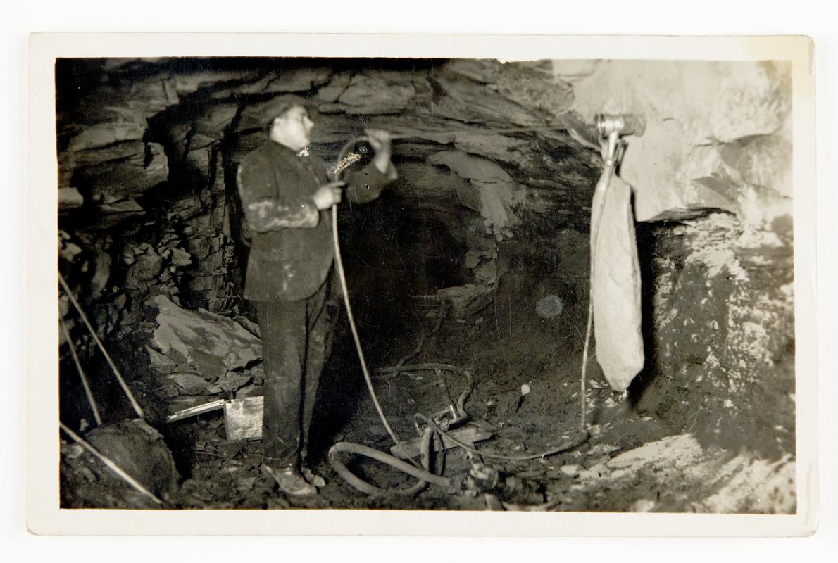 Photograph showing Stan Williams' dust trap invention in action underground.