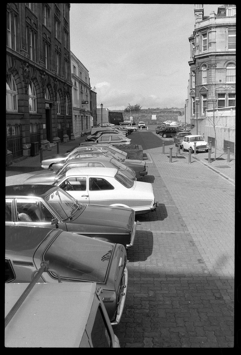 Cars parked in front of Exchange Building.