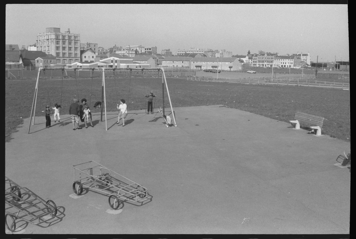 Children's playground with rear of James Street in background.