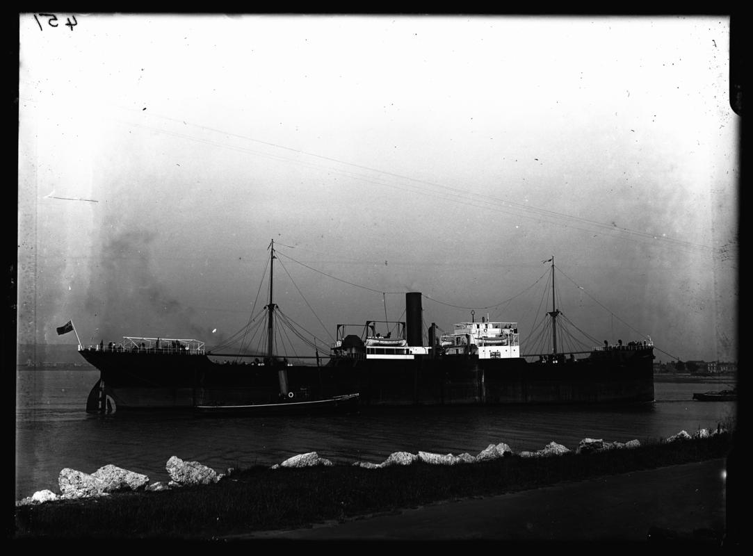 Starboard broadside view of S.S. GRANGEPARK and tug Falcon, c.1936.
