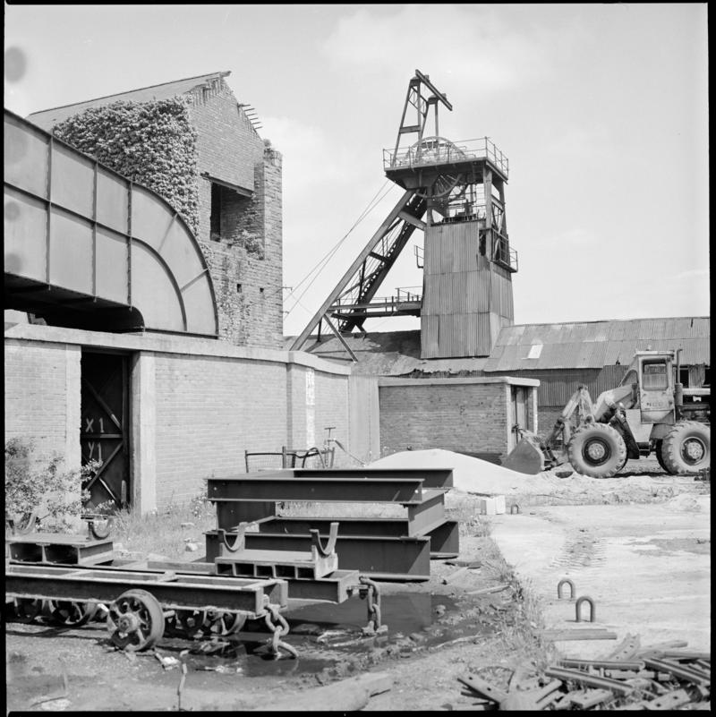 Black and white film negative showing a surface view of Morlais Colliery, including the derelict pumping house which contained a beam pump. 'Morlais' is transcribed from original negative bag.