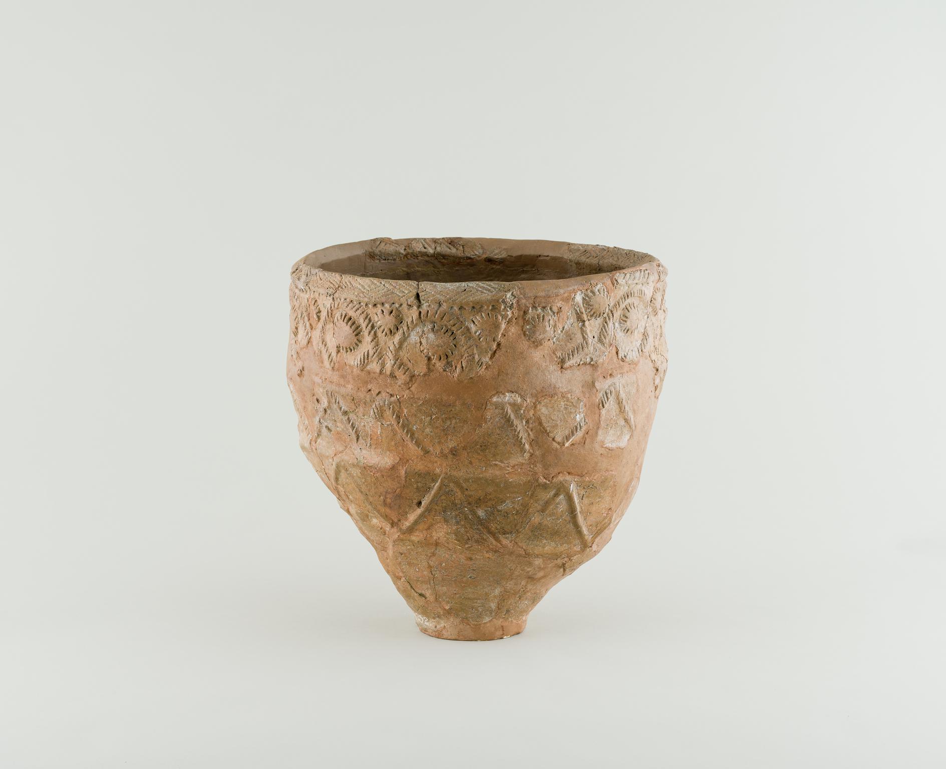 Early Bronze Age pottery encrusted urn