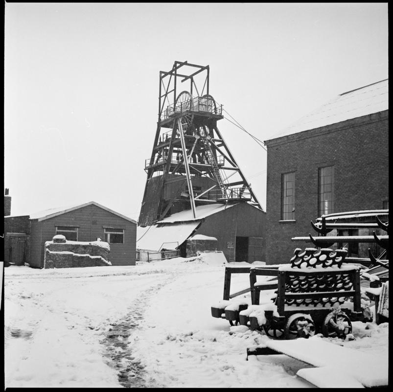 Black and white film negative showing a view towards the headframe and engine house, Big Pit.