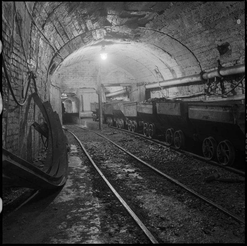 Black and white film negative showing coal drams underground at Nantgarw Colliery.  'Nantgarw' is transcribed from original negative bag.