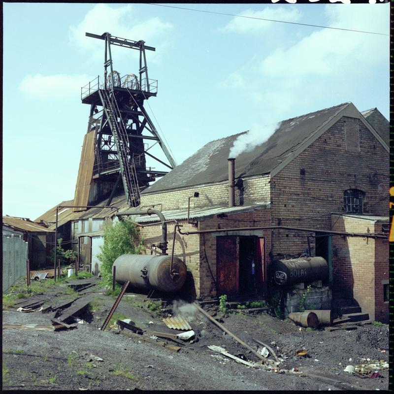 Colour film negative showing a view of the headgear and engine house, Morlais Colliery 13 May 1981.  'Morlais 13/5/81' is transcribed from original negative bag.  Appears to be identical to 2009.3/1819.