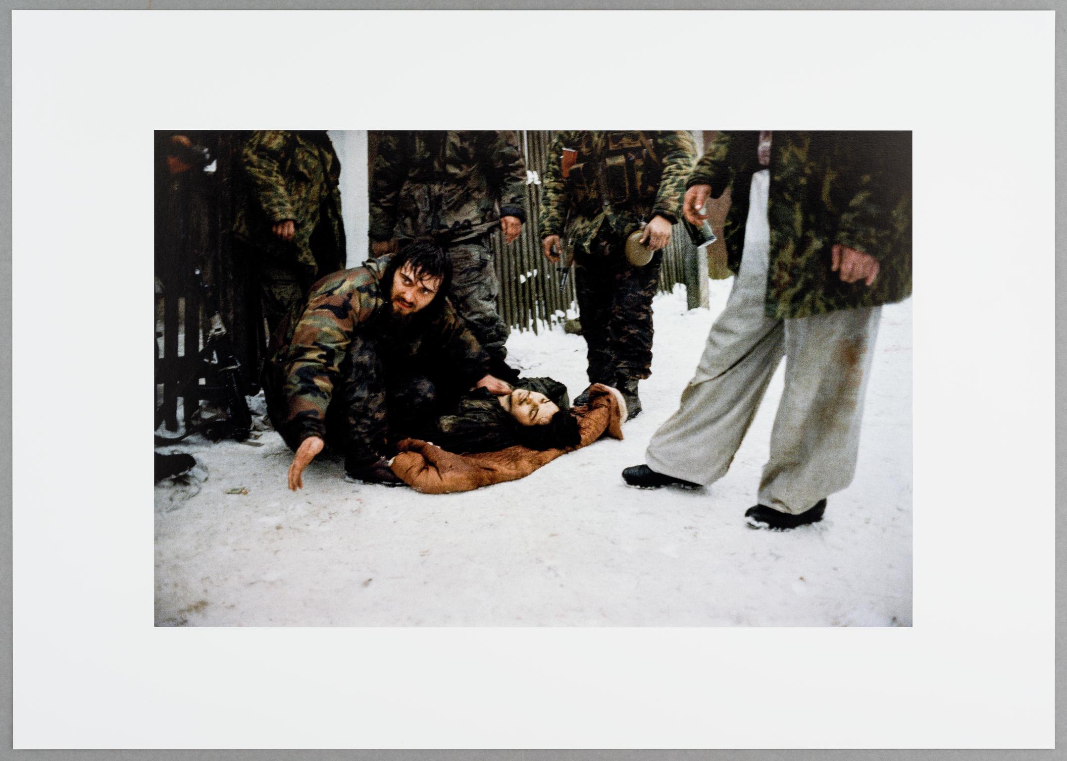 Chechen fighters try to save a injured comrade, who died few hours later.