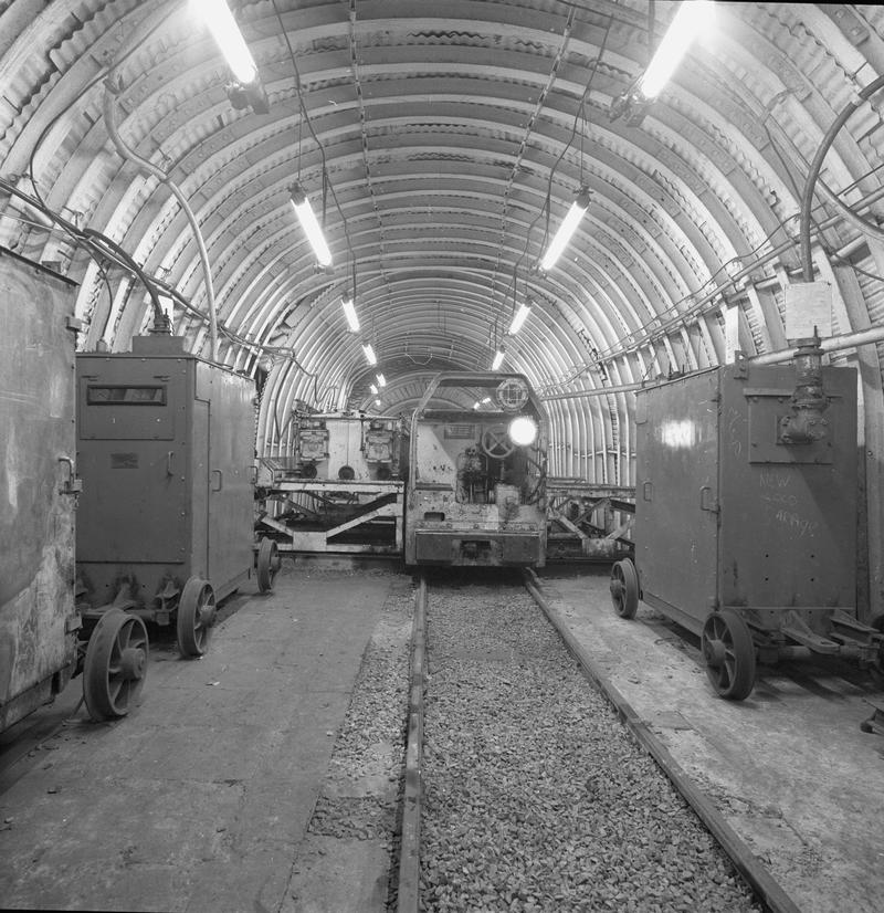Black and white film negative showing an electric locomotive underground at Oakdale Colliery, May 1980.  'Oakdale May 1980' is transcribed from original negative bag.