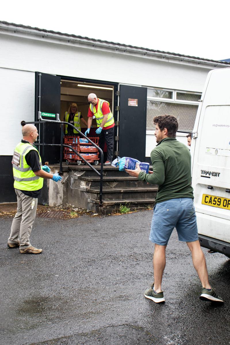 Staff and volunteers from Made in Tredegar preparing and delivering food during Covid-19 pandemic.