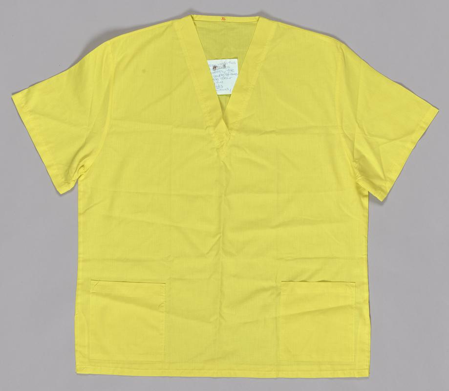 Yellow shirt, part of a two piece scrubs set.