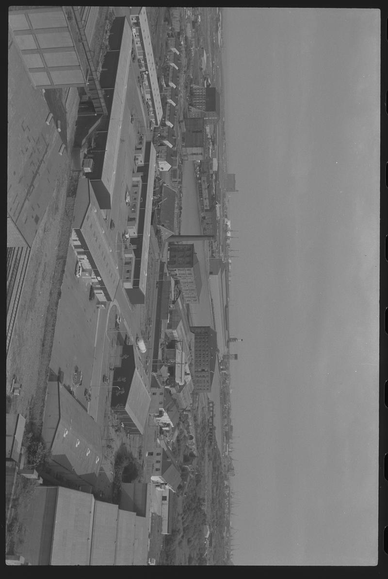 View to south east Butetown with Tyndall Street Industrial Area in foreground, with East Dock, Spillers Building and Pier Head Building in background.