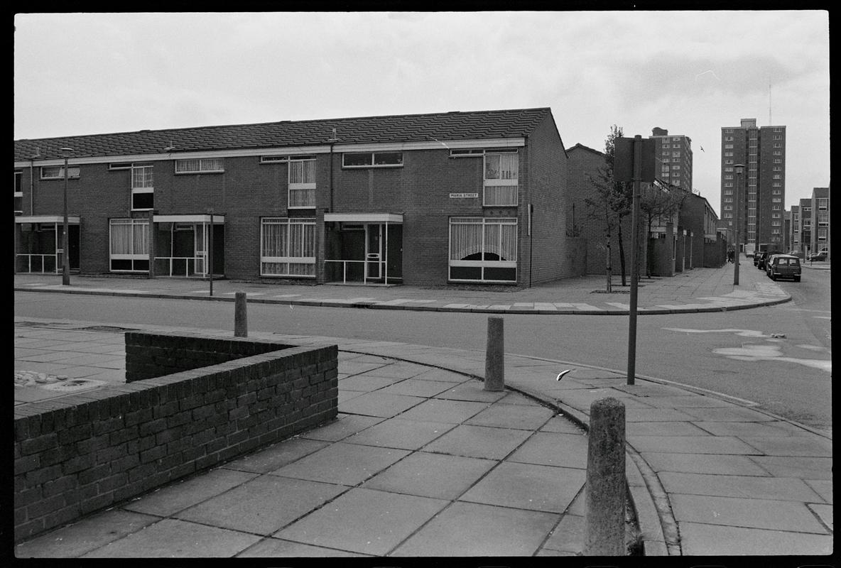 Road near Loudoun Square, with semi-detached houses and flats in background, Butetown.