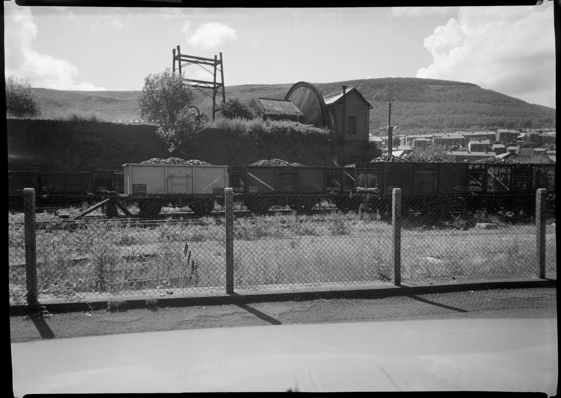 Black and white film negative showing a distant view of the waddle fan and engine house, Nixon's Navigation Colliery 1971.  'Waddle fan 1971' is transcribed from original negative bag.