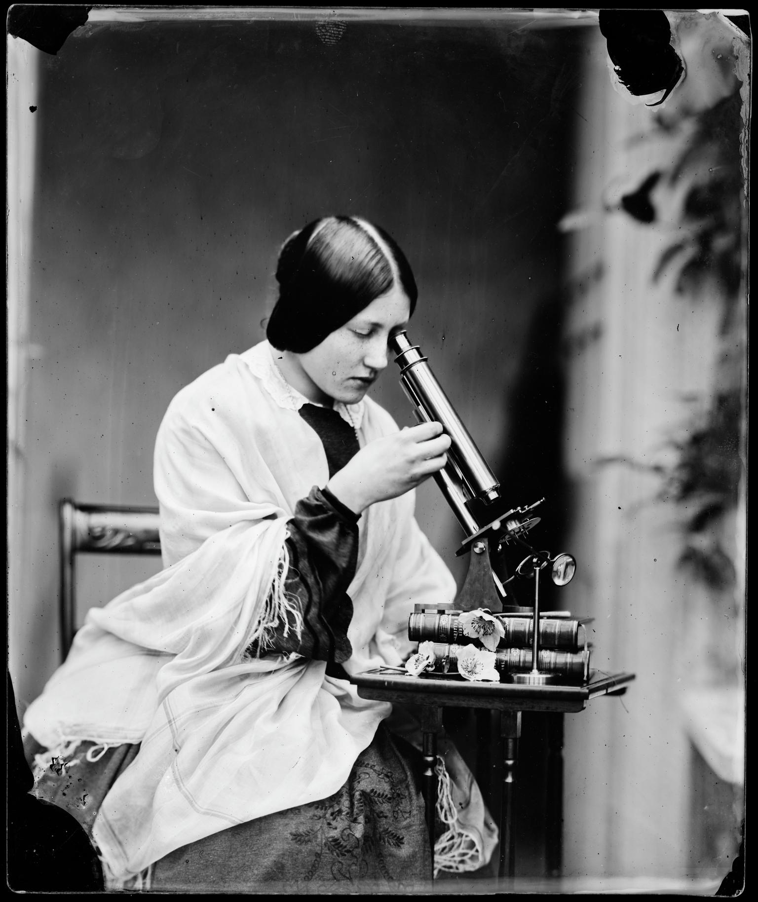 Thereza with microscope, glass negative