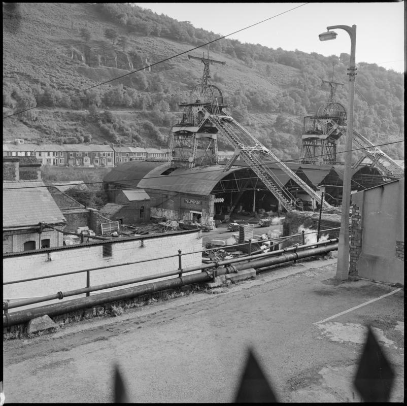 Black and white film negative showing the downcast and upcast headframes, Six Bells Colliery 23 September 1979.  'Six Bells 23 Sept 1975' is transcribed from original negative bag.  Appears to be identical to 2009.3/2914.
