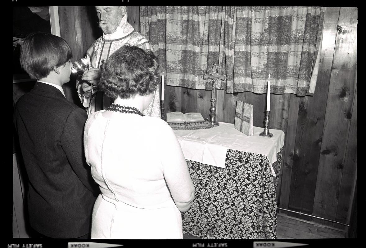 Negative of Holy Communion being celebrated at the small chapel in the Missions To Seamen centre at Bute West Dock, Cardiff.